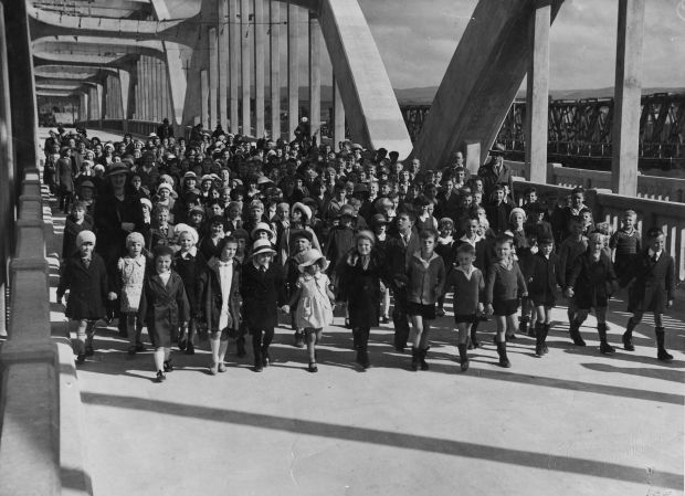 Children walk across the bridge, 1935
